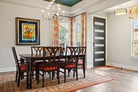 a view of a dining room with furniture and window