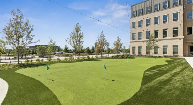 a building with swimming pool in front of it