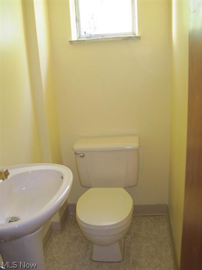 1129 Croyden Road Lyndhurst, OH 44124 - Photo 9 of 25 The newly remodeled first floor half bath is conveniently located near the kitchen.