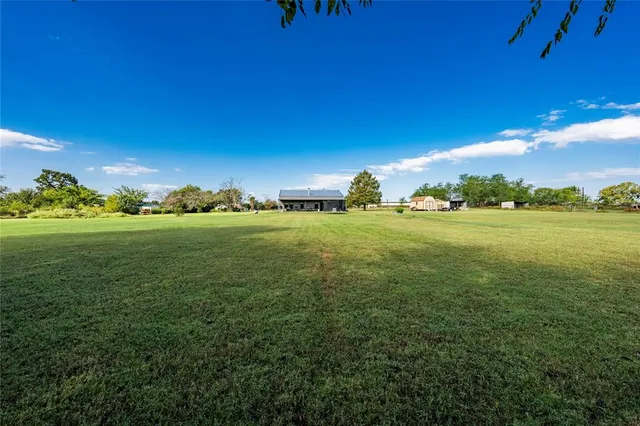 a view of a golf course with a big yard