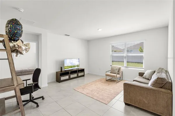 a living room with furniture and a window