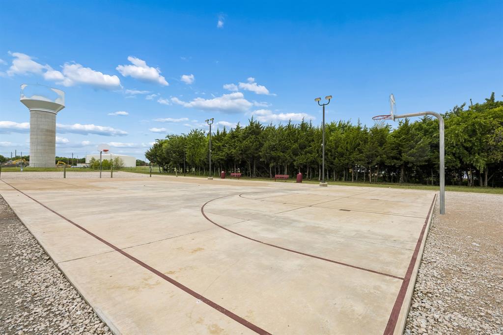 638 Hazeltine Road Red Oak, TX 75154 - Photo 29 of 29 a backyard of a house with lots of green space and outdoor seating