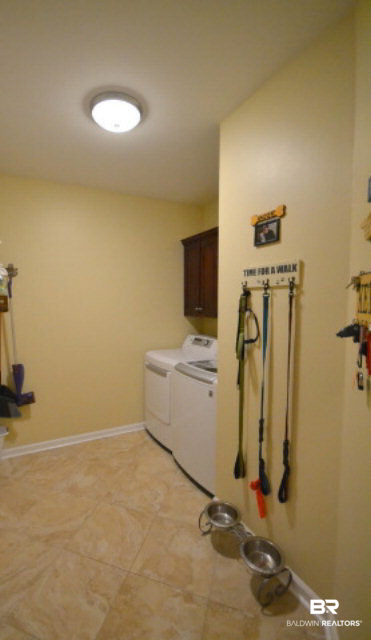 1640 Augusta Drive West Mobile, AL 36695 - Photo 7 of 25 Large laundry room with cabinets and shelving.