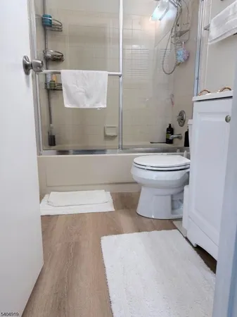 a bathroom with a toilet and a tub