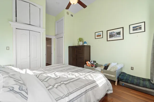 a bedroom with bed and a window