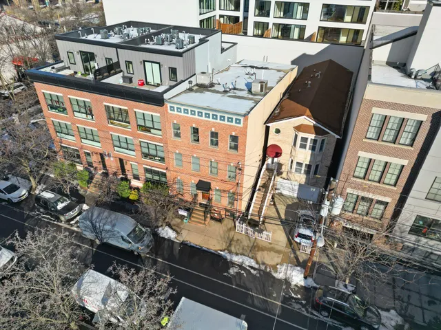 a view of a brick building with many windows