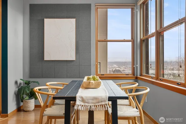 a dining room with furniture and window