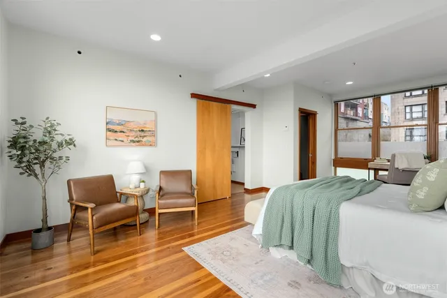 a bedroom with a bed and a chair