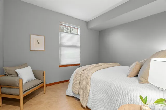 a bedroom with a bed and a couch