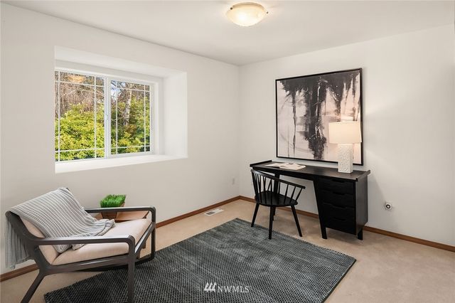 a workspace with furniture and a window