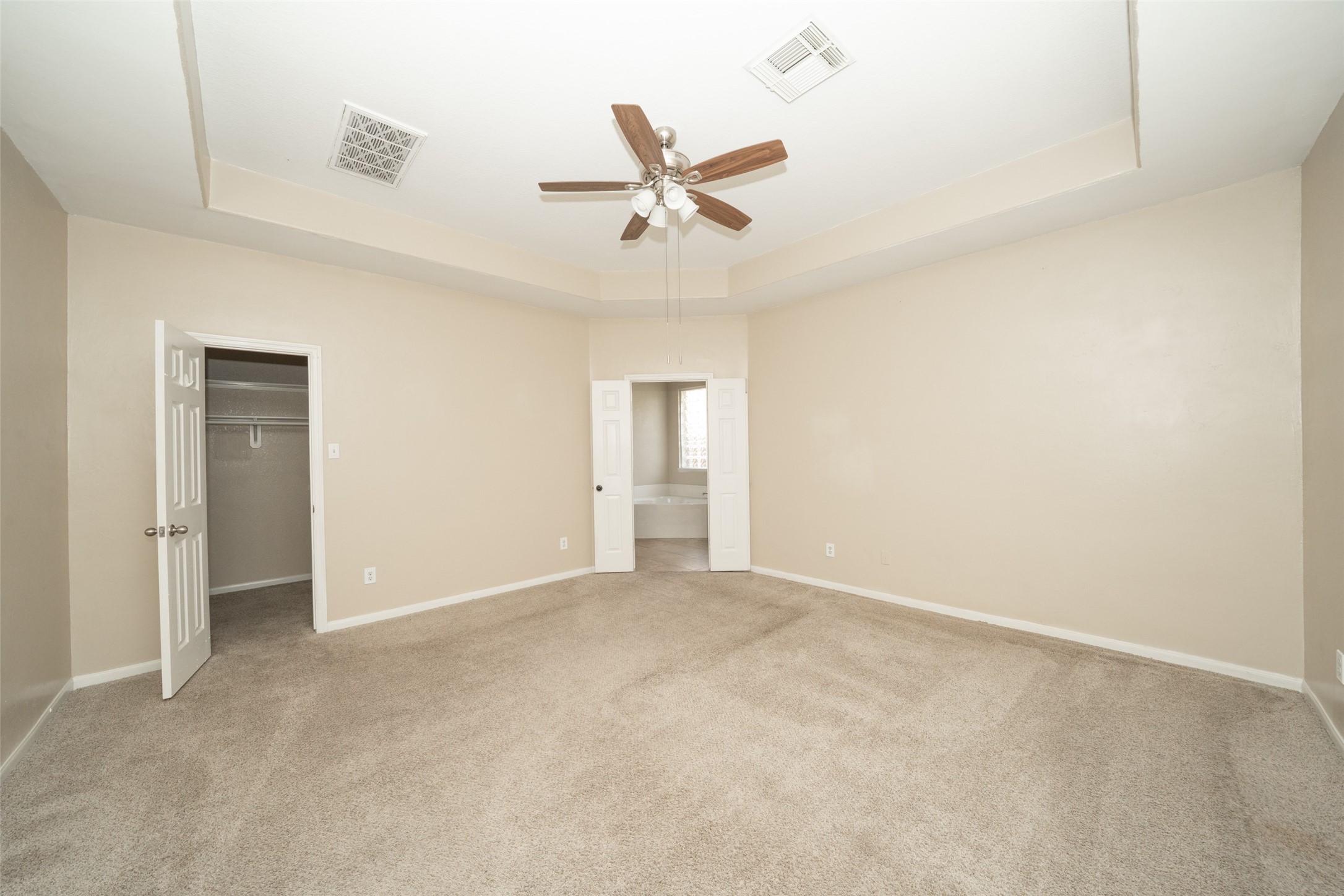 14410 Floret Estates Lane Cypress, TX 77429 - Photo 16 of 27 an empty room with closet and windows
