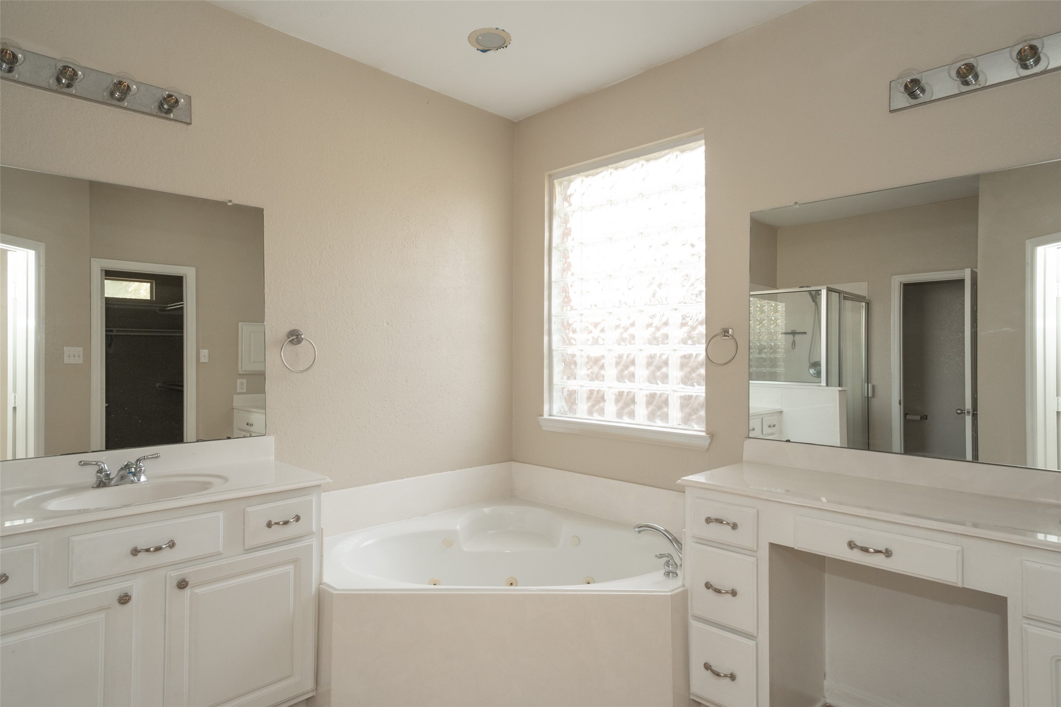 14410 Floret Estates Lane Cypress, TX 77429 - Photo 17 of 27 a bathroom with a bathtub sink and mirror
