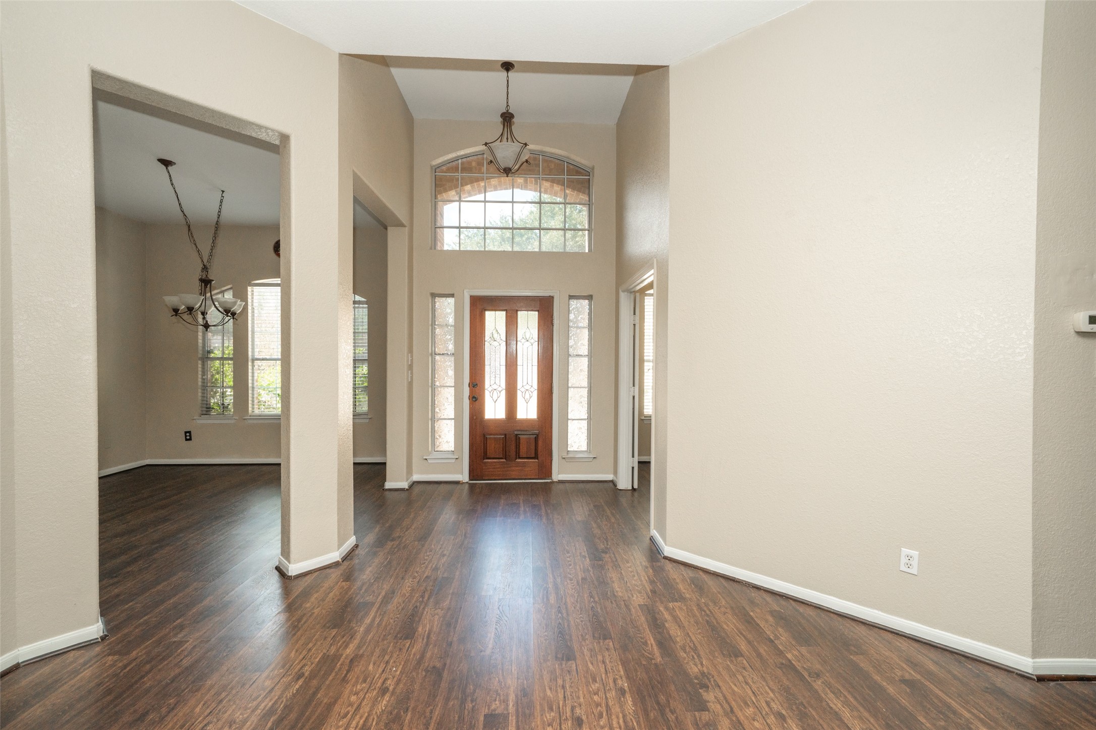 14410 Floret Estates Lane Cypress, TX 77429 - Photo 2 of 27 an empty room with wooden floor and windows