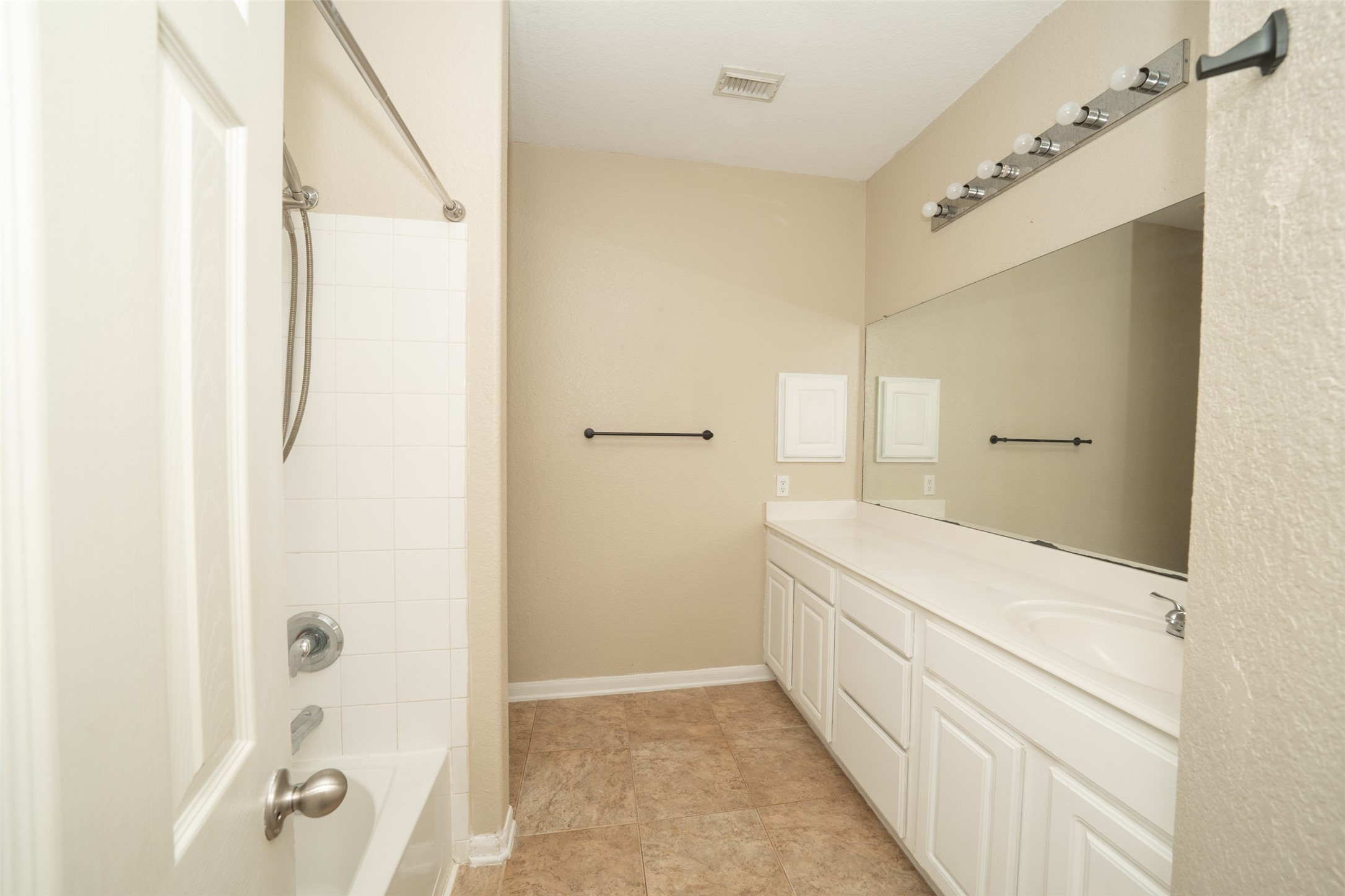 14410 Floret Estates Lane Cypress, TX 77429 - Photo 24 of 27 a bathroom with a bathtub and a shower