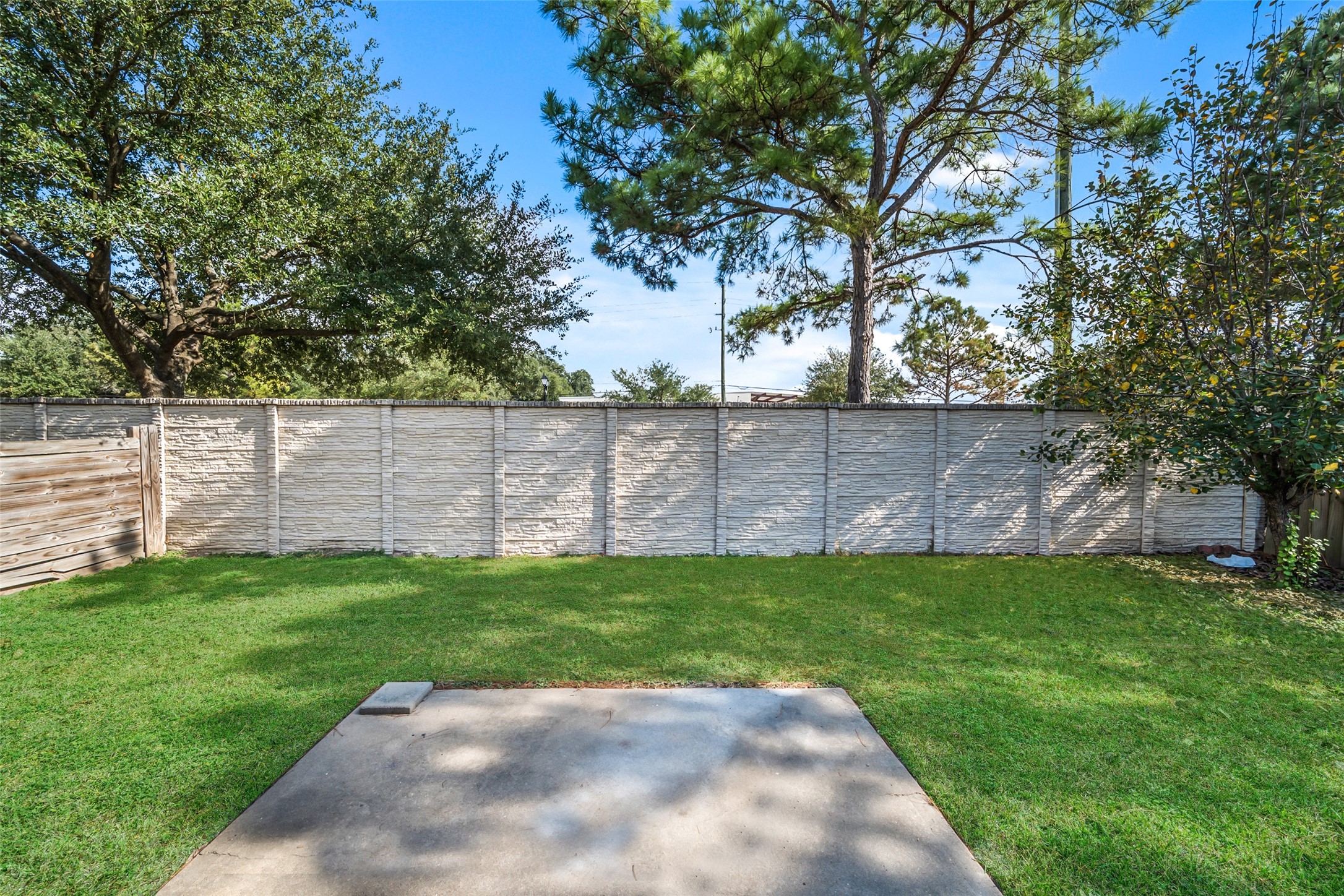 14410 Floret Estates Lane Cypress, TX 77429 - Photo 25 of 27 a view of a backyard with a garden