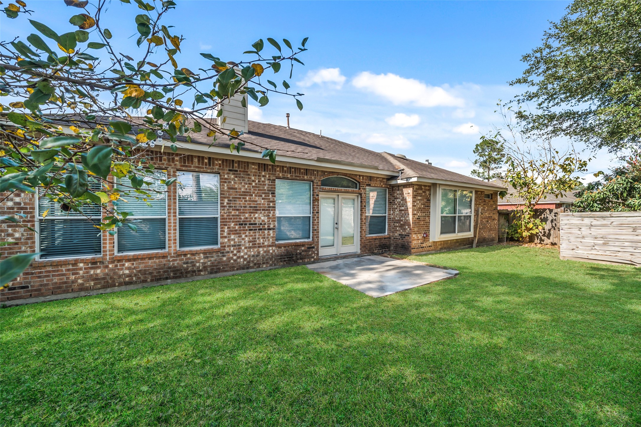 14410 Floret Estates Lane Cypress, TX 77429 - Photo 26 of 27 a backyard of a house with table and chairs