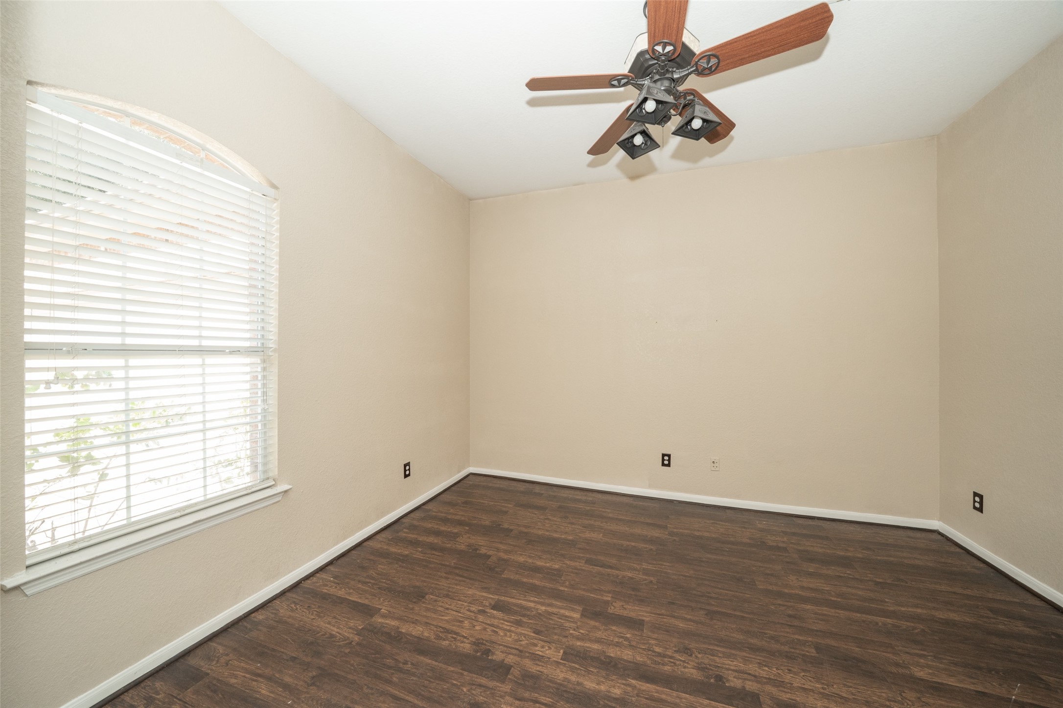 14410 Floret Estates Lane Cypress, TX 77429 - Photo 6 of 27 wooden floor in an empty room with a window