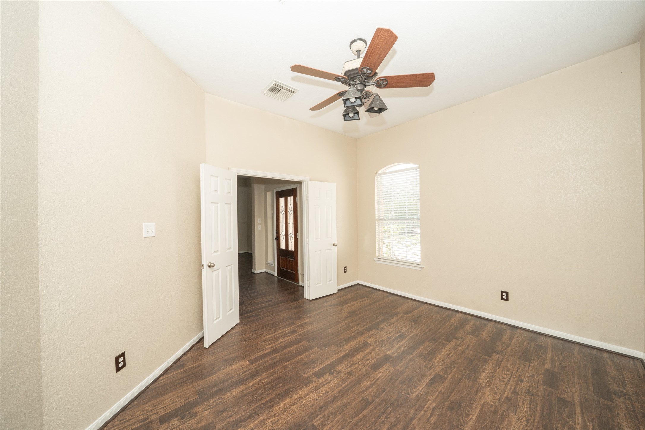 14410 Floret Estates Lane Cypress, TX 77429 - Photo 7 of 27 wooden floor in an empty room with a window