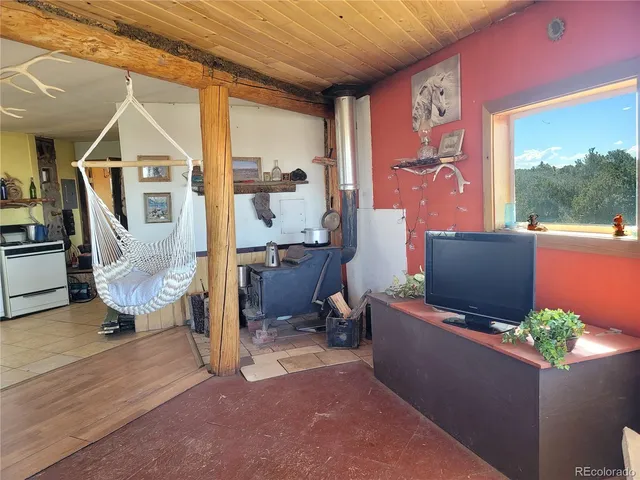 a kitchen with a sink window and cabinets