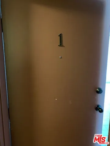 a view of an empty room and a window