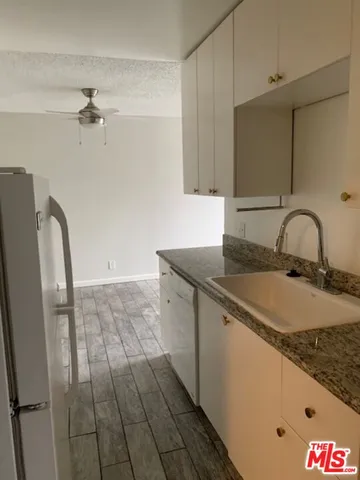 a view of a kitchen with a sink cabinets and a window