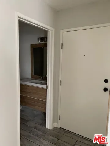 a kitchen with granite countertop a sink and a stove top oven