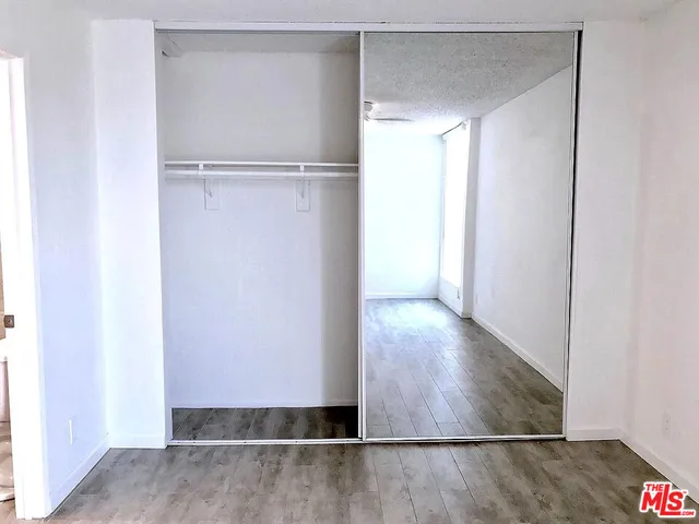 a view of a bathroom with a sink and a mirror