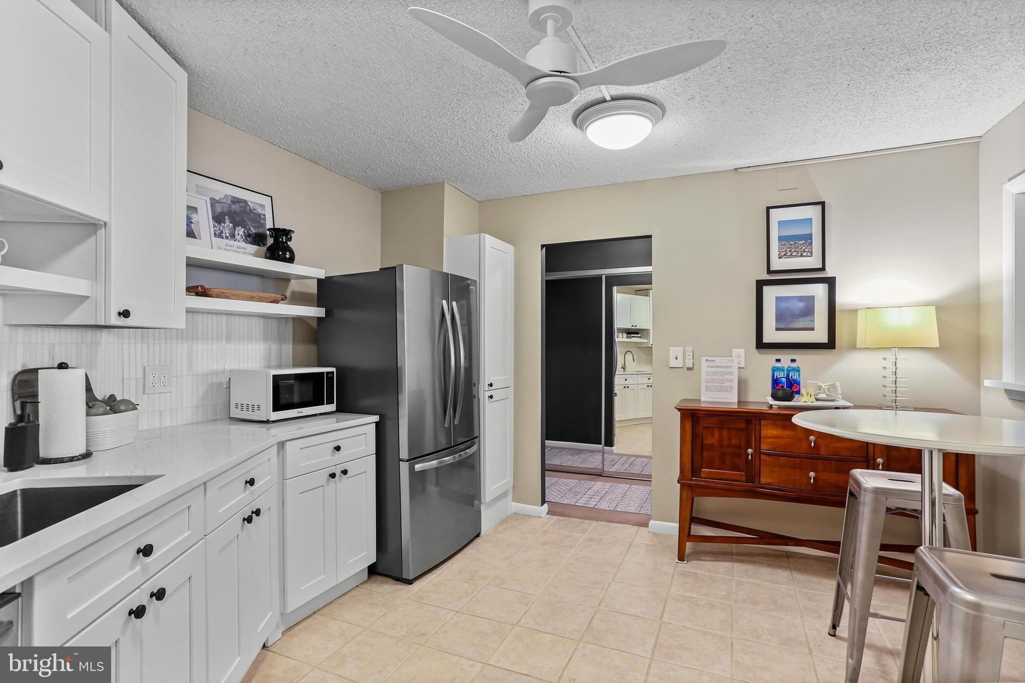 205 East Joppa Road, Unit 1907 Towson, MD 21286 - Photo 11 of 33 a kitchen with stainless steel appliances a refrigerator sink and cabinets