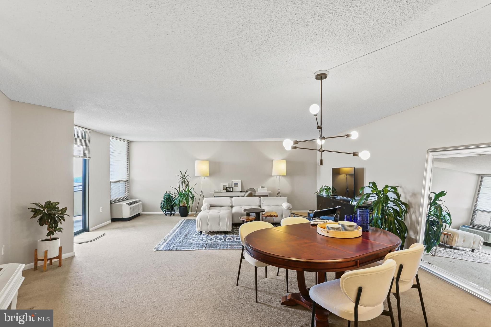 205 East Joppa Road, Unit 1907 Towson, MD 21286 - Photo 2 of 33 a view of a dining room with furniture and wooden floor