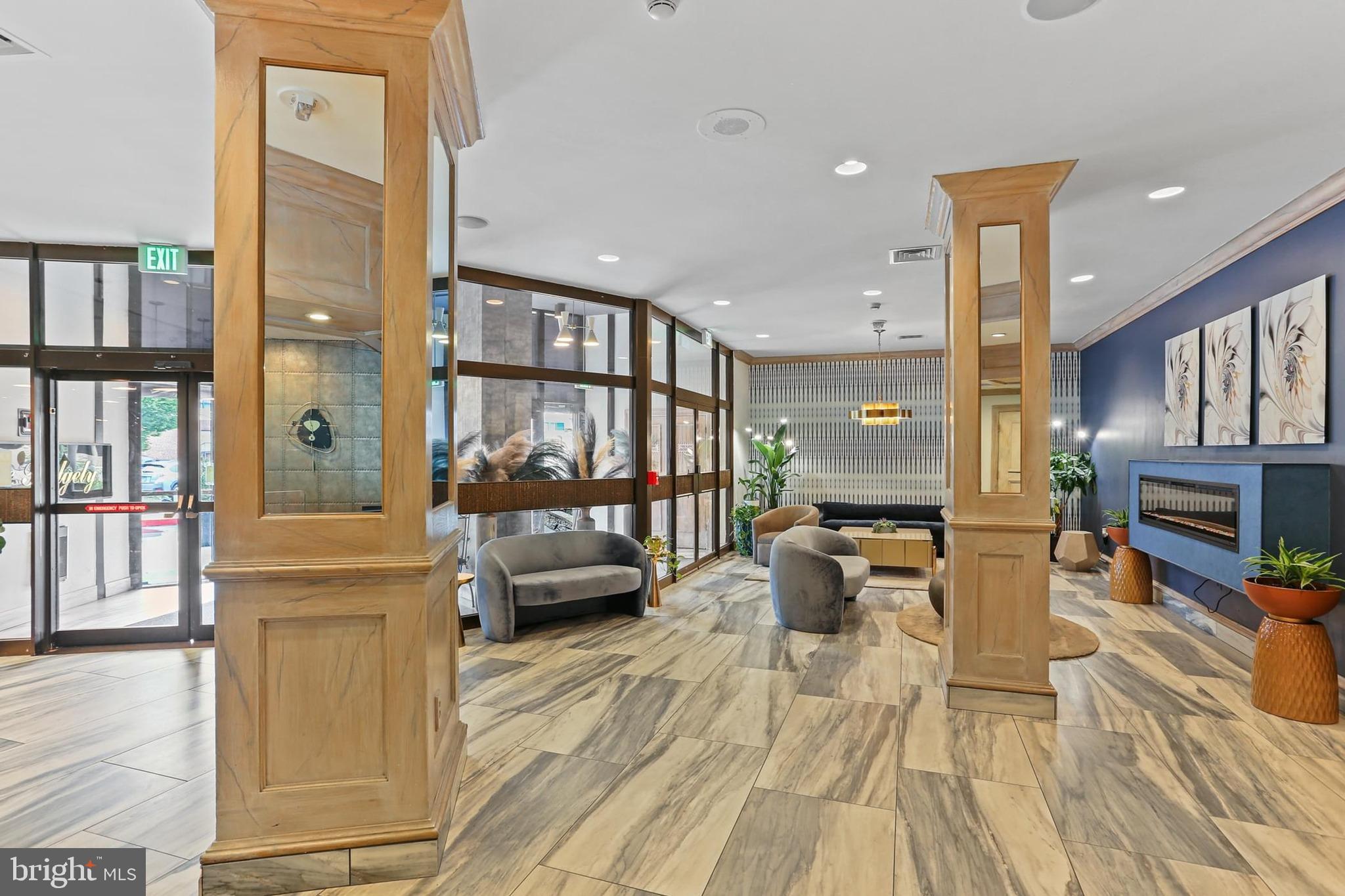 205 East Joppa Road, Unit 1907 Towson, MD 21286 - Photo 24 of 33 a living room with furniture fireplace and a flat screen tv