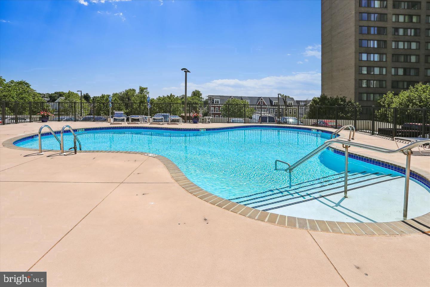 205 East Joppa Road, Unit 1907 Towson, MD 21286 - Photo 26 of 33 a view of a swimming pool with a chairs