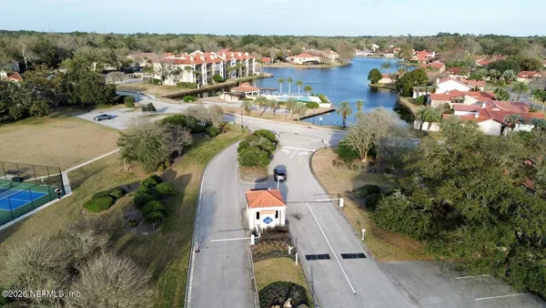 an aerial view of residential houses with outdoor space