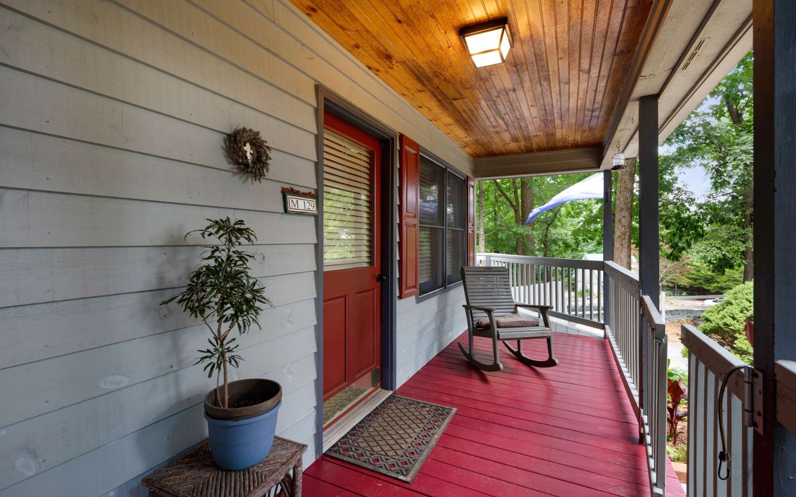 1003 Walnut Ridge Ellijay, GA 30536 - Photo 4 of 51 a porch with furniture and wooden floor