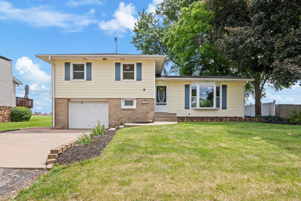604 3rd Street Sherrard, IL 61281 - Photo 2 of 6 a house view with a garden space