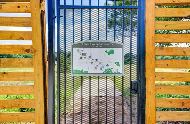 a view of a house with yard and lake view