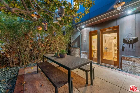 a view of a backyard with chairs
