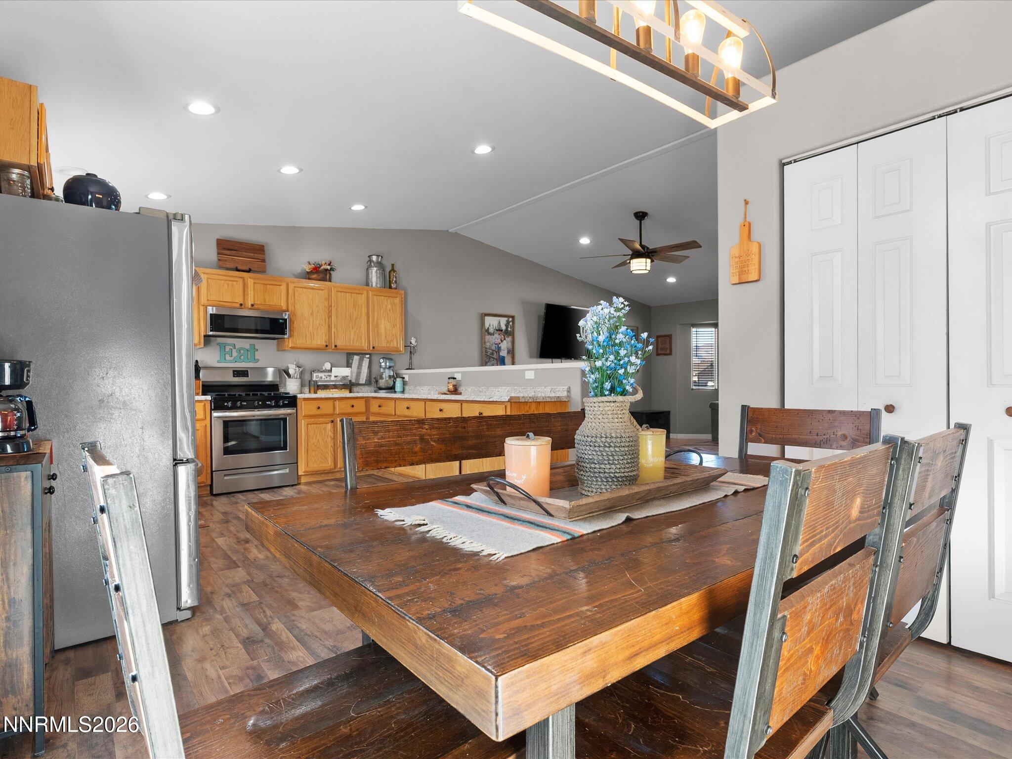 668 Farm Circle Fernley, NV 89408 - Photo 20 of 46 a dining hall with stainless steel appliances a dining table and chairs