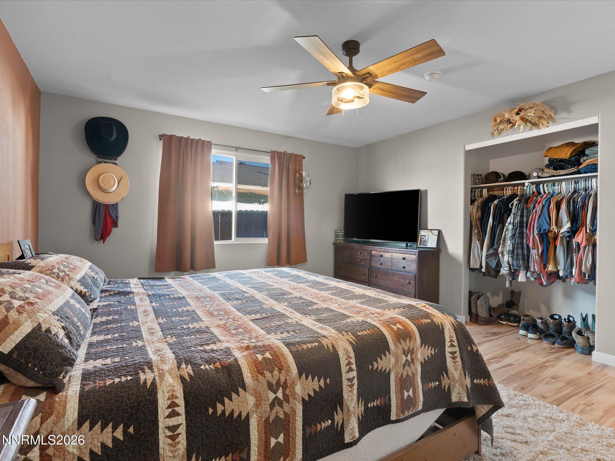 668 Farm Circle Fernley, NV 89408 - Photo 24 of 46 a bedroom with a bed and a flat screen tv