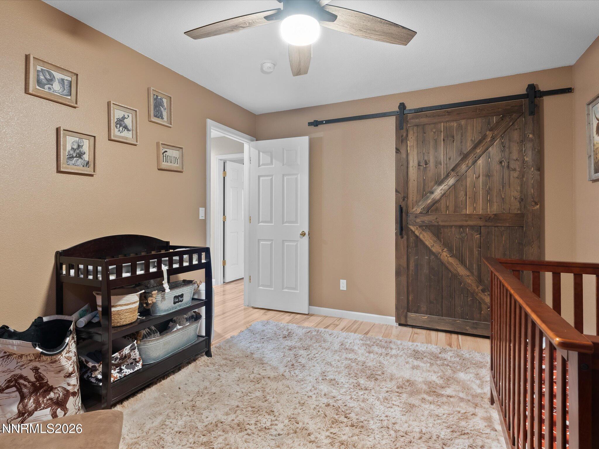 668 Farm Circle Fernley, NV 89408 - Photo 28 of 46 a bedroom with furniture and a window