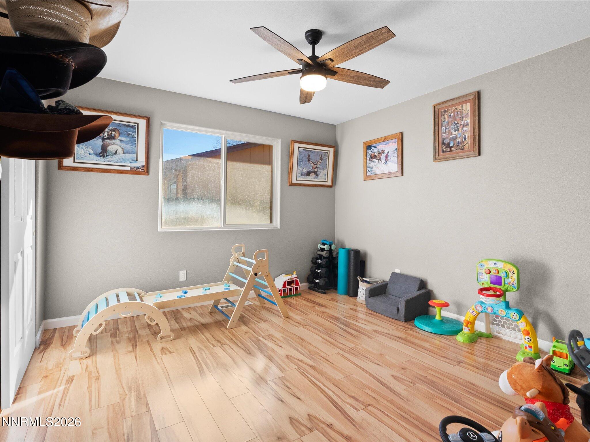 668 Farm Circle Fernley, NV 89408 - Photo 30 of 46 a bedroom with a bed and a window