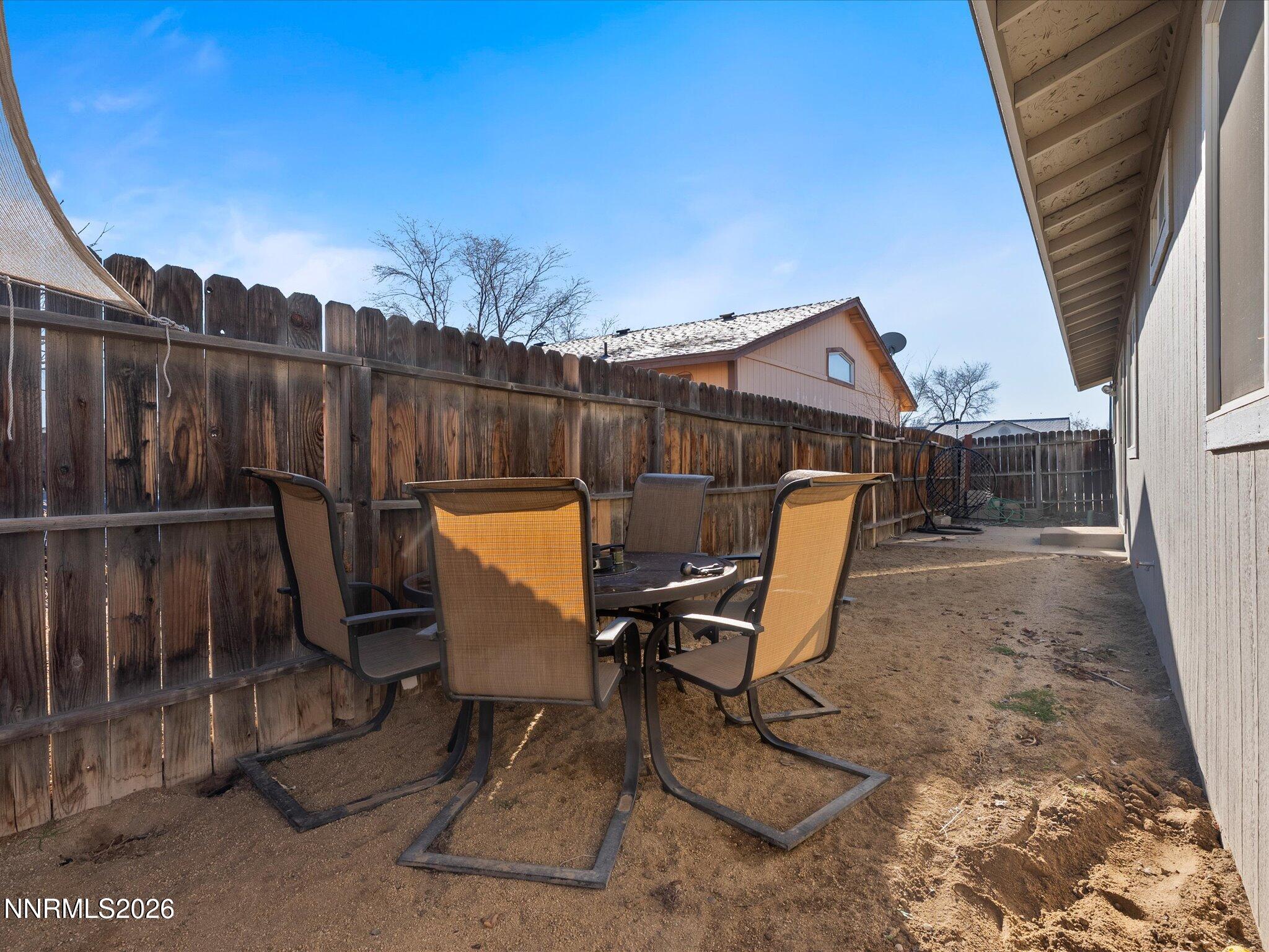 668 Farm Circle Fernley, NV 89408 - Photo 33 of 46 a view of a chairs and table in patio
