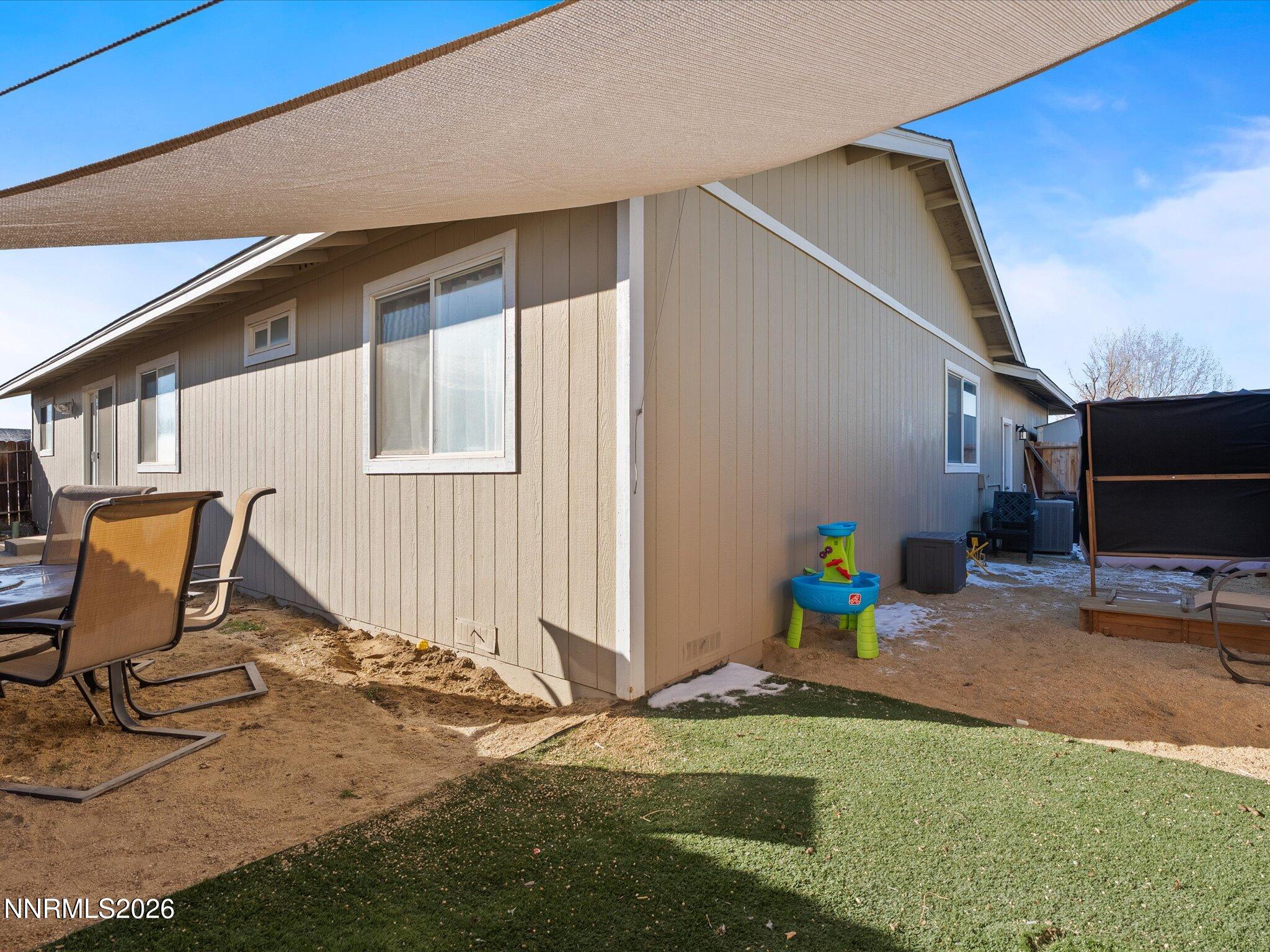 668 Farm Circle Fernley, NV 89408 - Photo 34 of 46 a view of a backyard with sitting area
