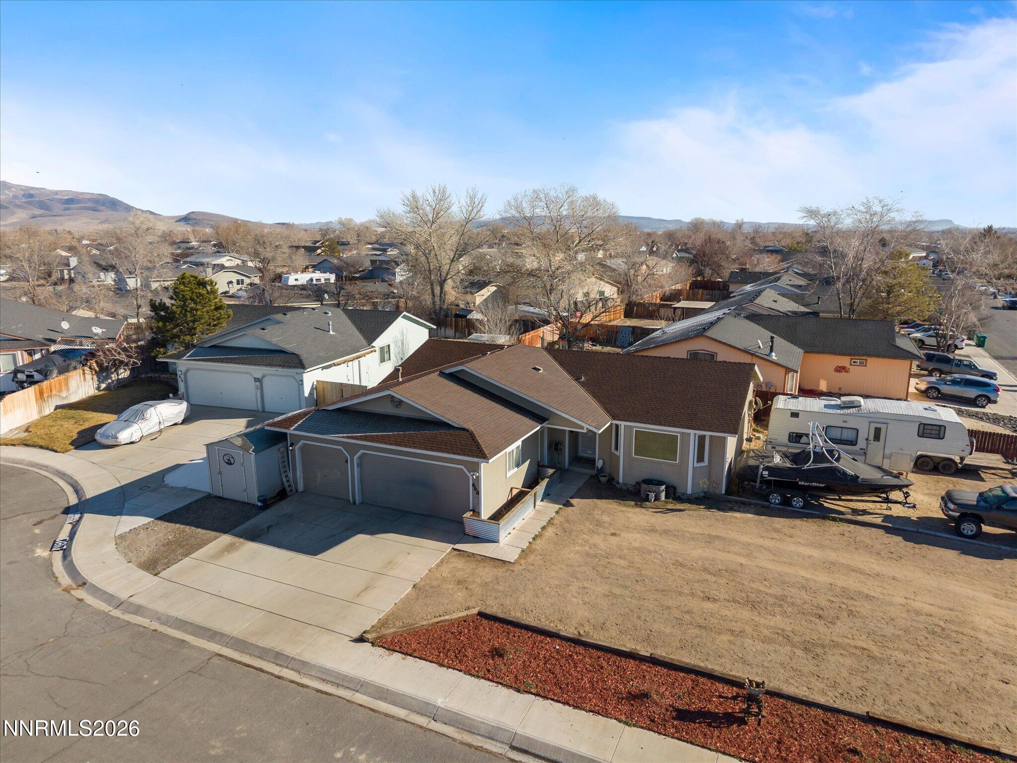 668 Farm Circle Fernley, NV 89408 - Photo 35 of 46 a view of multiple houses with a street