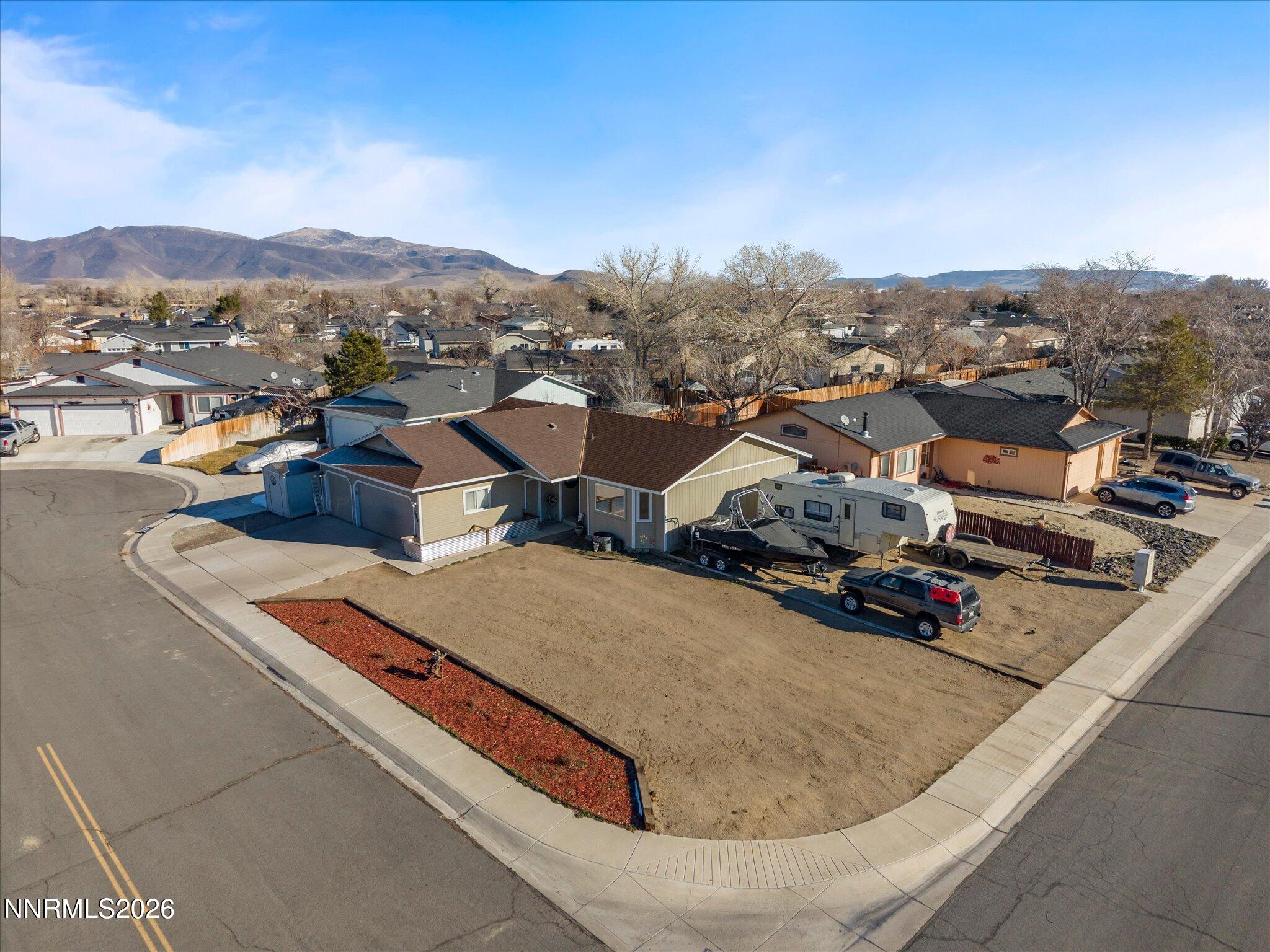 668 Farm Circle Fernley, NV 89408 - Photo 38 of 46 an aerial view of residential houses with outdoor space