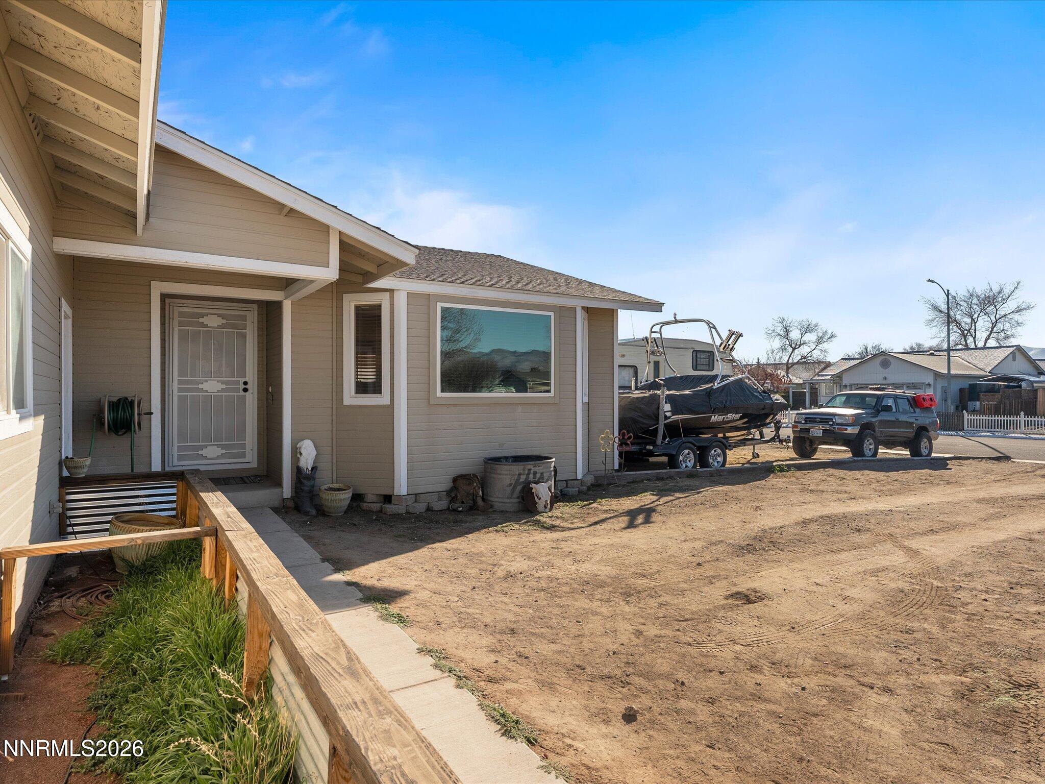 668 Farm Circle Fernley, NV 89408 - Photo 4 of 46 a view of car parked in front of house