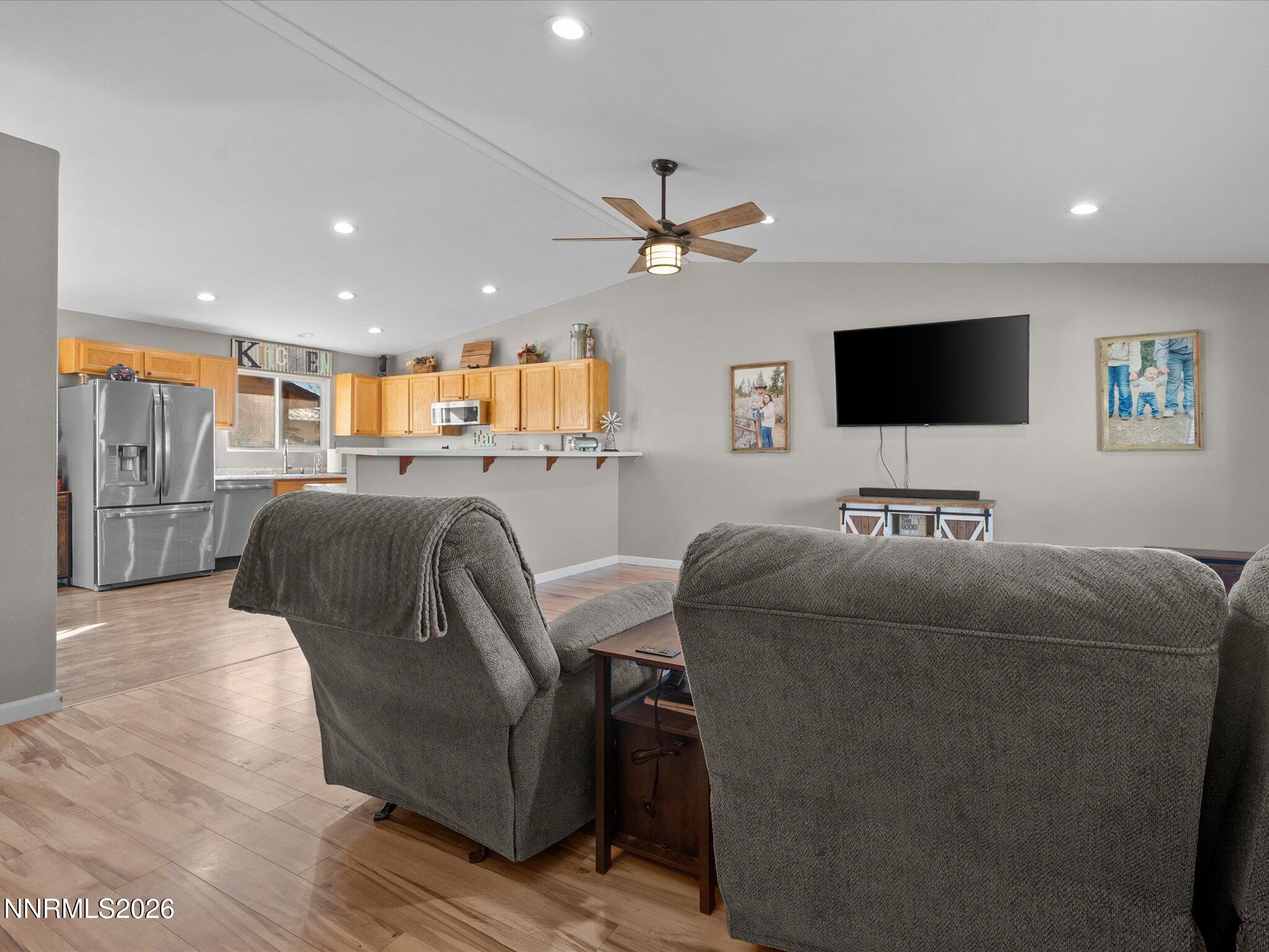 668 Farm Circle Fernley, NV 89408 - Photo 5 of 46 a living room with furniture and a flat screen tv