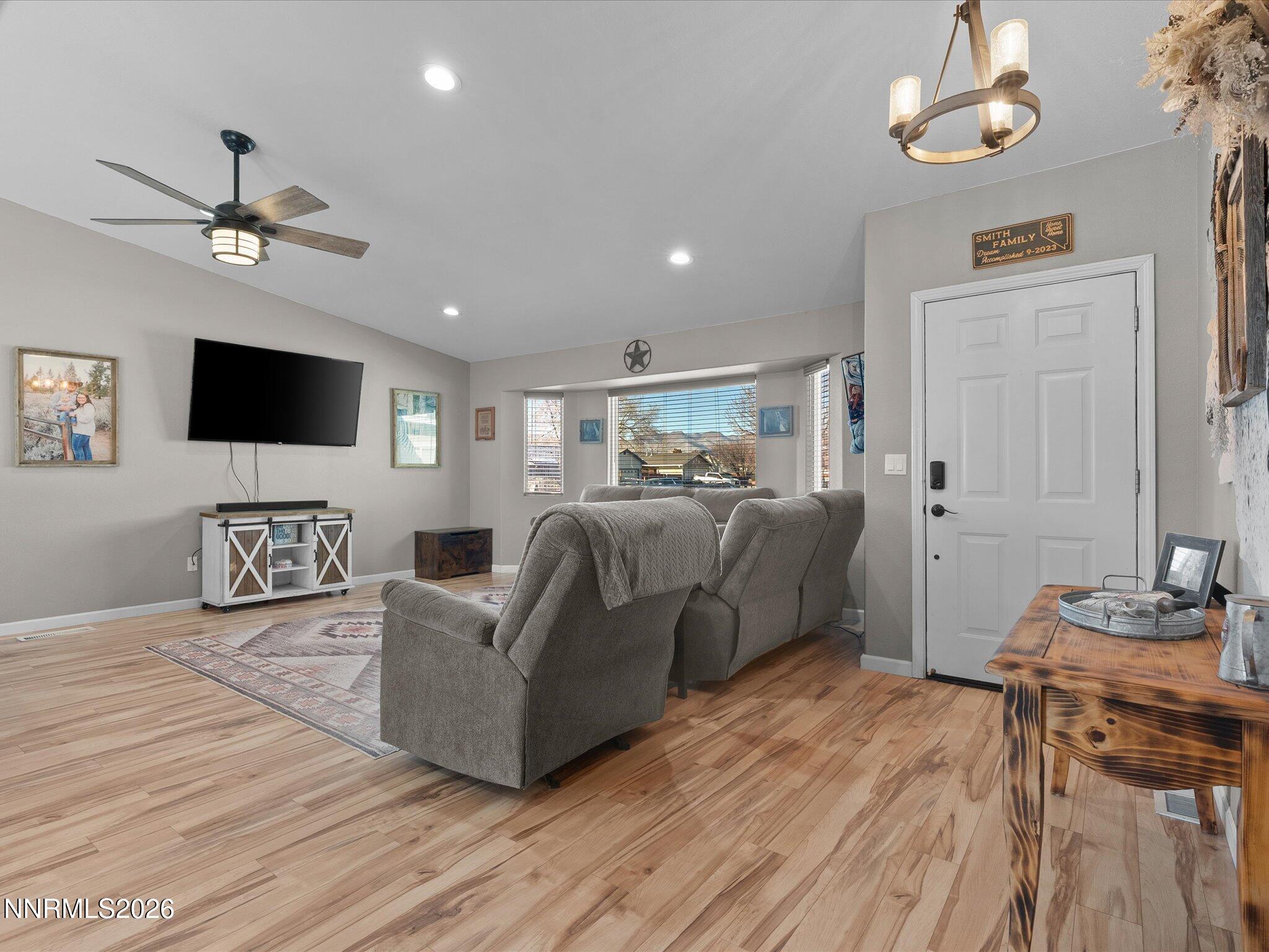 668 Farm Circle Fernley, NV 89408 - Photo 6 of 46 a living room with furniture and a flat screen tv