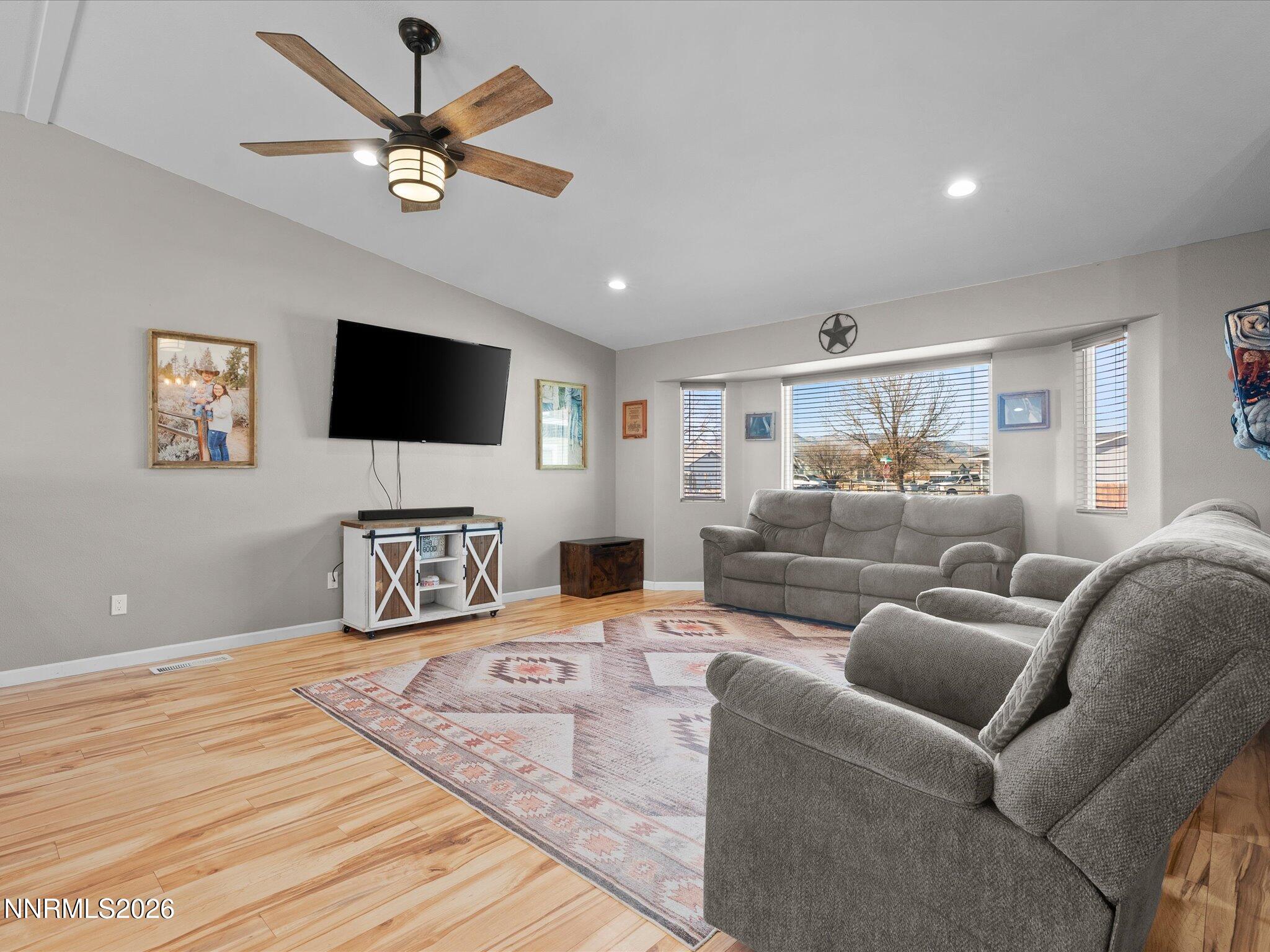 668 Farm Circle Fernley, NV 89408 - Photo 7 of 46 a living room with furniture and a flat screen tv