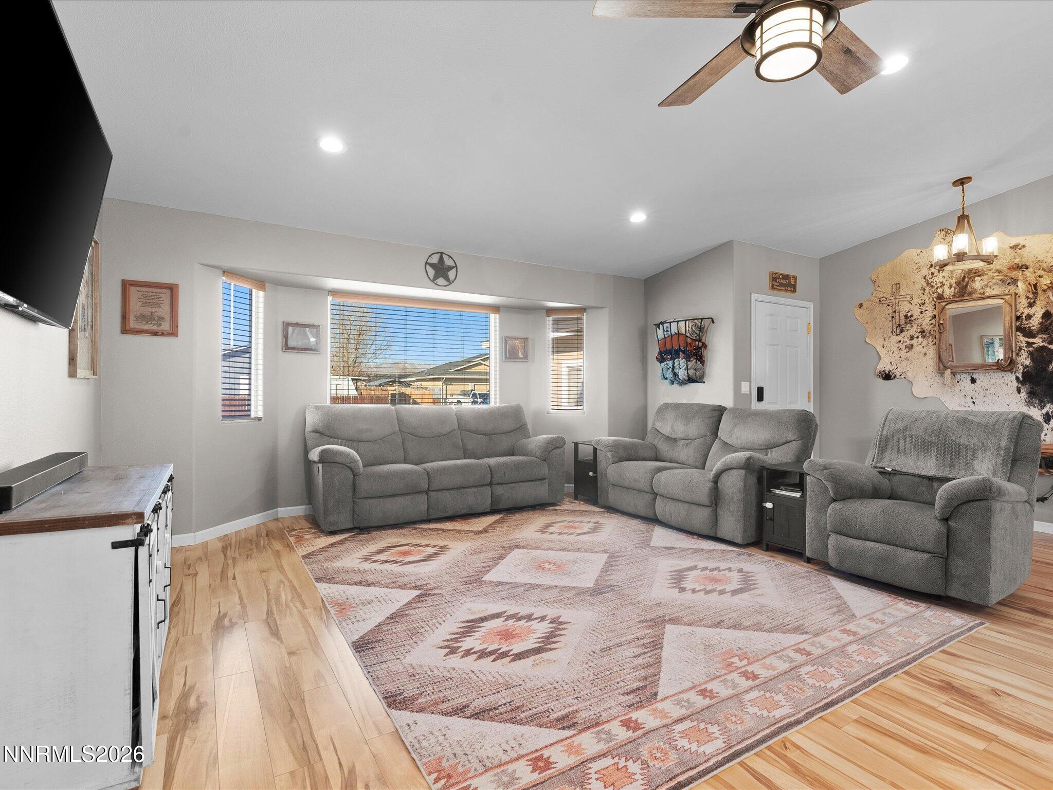 668 Farm Circle Fernley, NV 89408 - Photo 8 of 46 a large bedroom with a bed window and couch