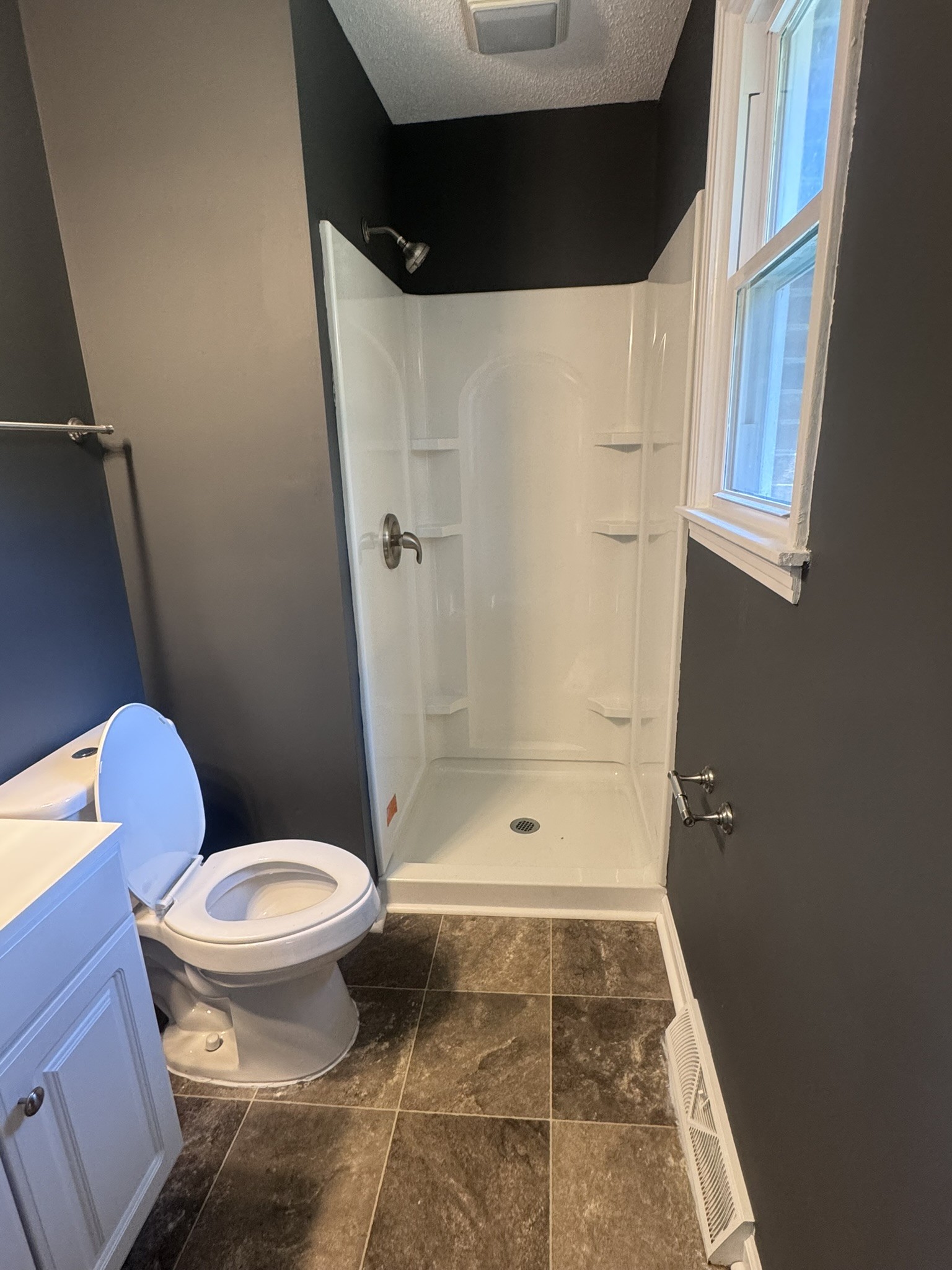 236 Raintree Drive Clarksville, TN 37042 - Photo 12 of 19 a bathroom with a toilet and a shower